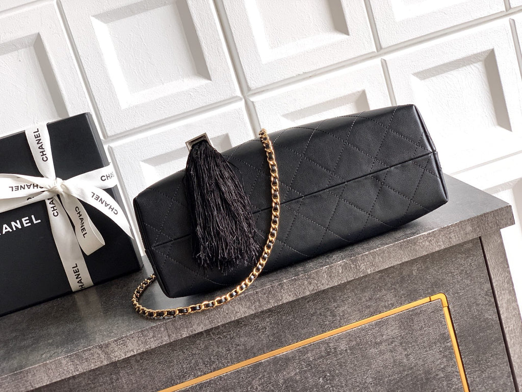 Quilted Leather Triangle Top Handle Bag