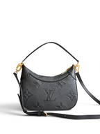 SWORD LUXURY siyah Monogram Empreinte deri Mini Moon çanta, altın tonlu donanım ve kavisli silüet ile.