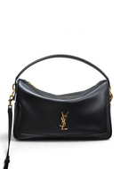SWORD LUXURY imzalı, altın renkli YSL logolu, siyah deri, yapılandırılmış Voltaire el çantası.