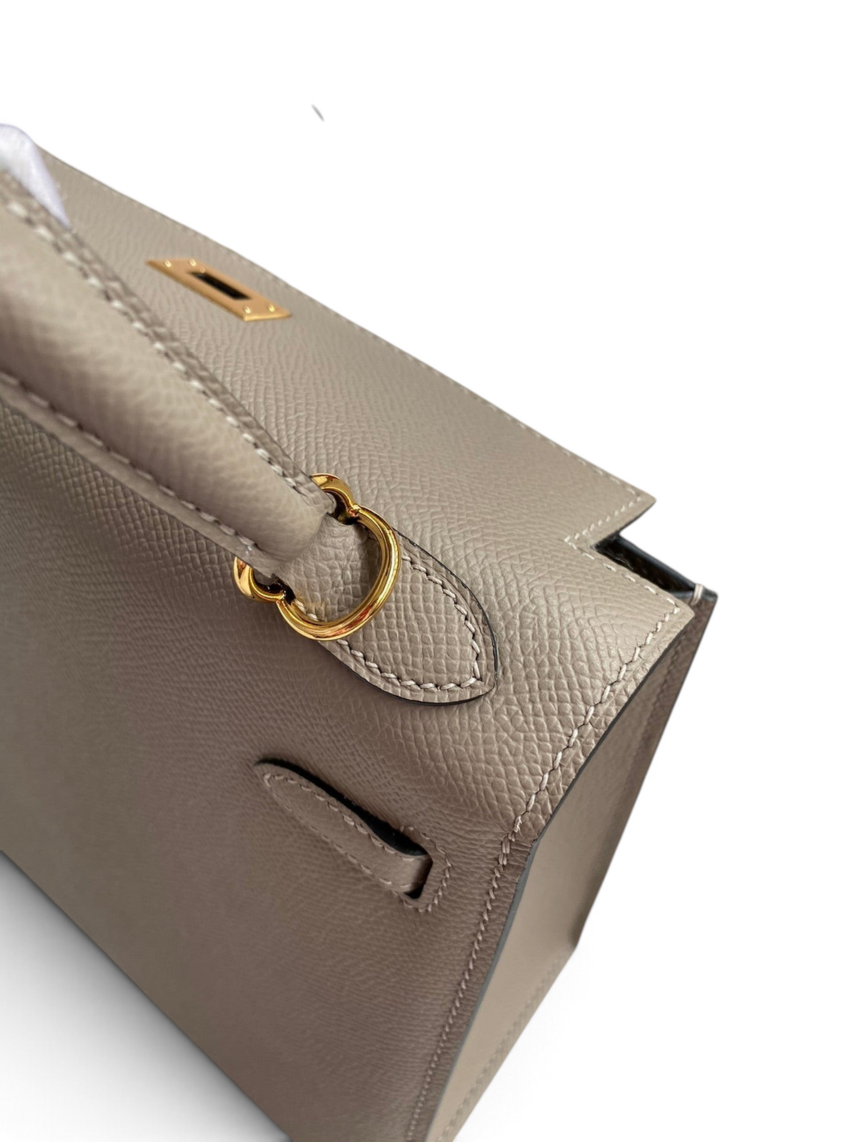 SWORD LUXURY marka gri Epsom deri Kelly 25 çanta, altın tonlu donanım ve zarif el işçiliği detayları ile.