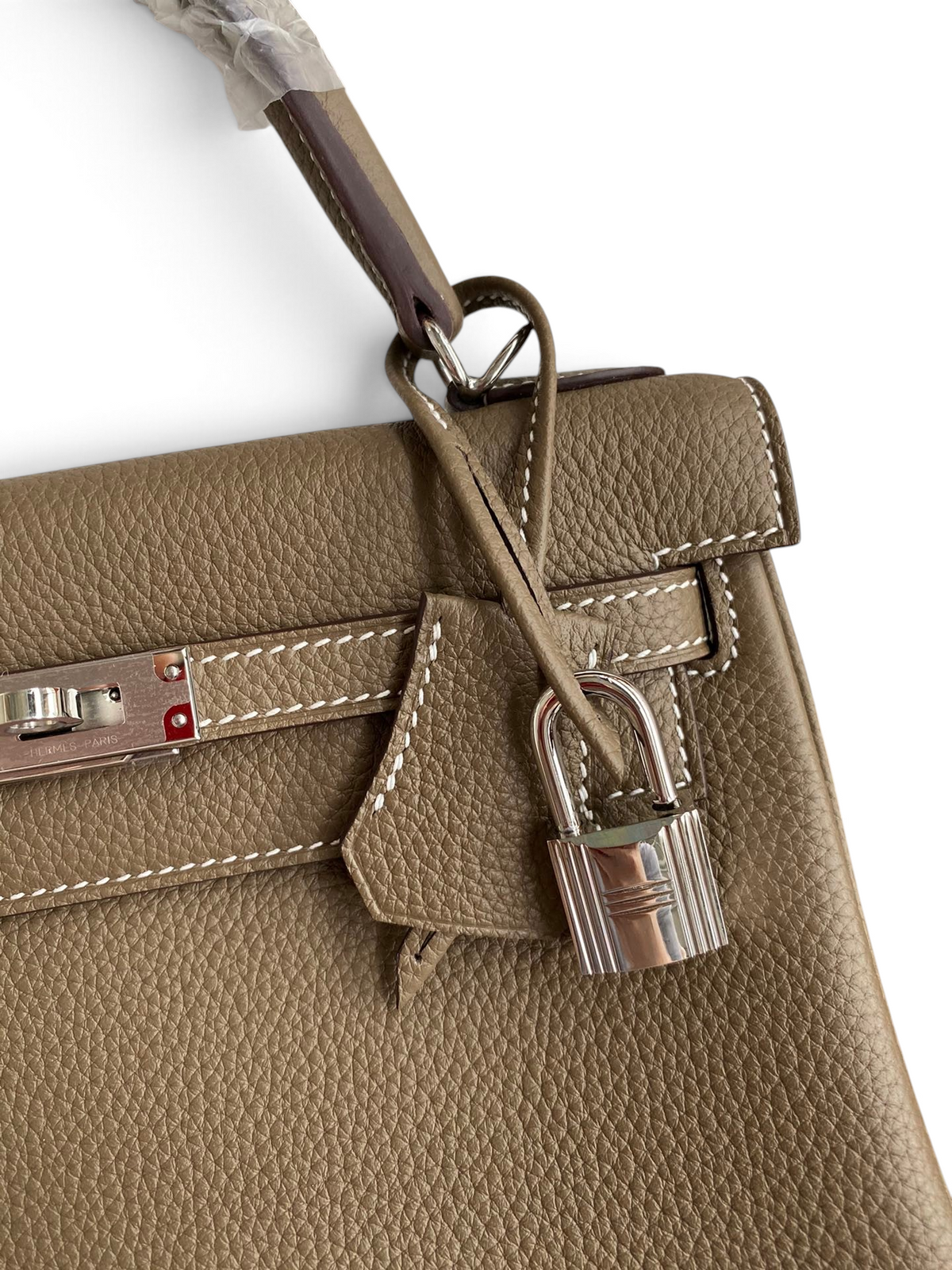 SWORD LUXURY Kelly 25 Togo deri çanta, gümüş donanımlı, ikonik kilit detaylı ve el işçiliği dikişli lüks tasarım.