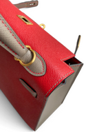 SWORD LUXURY marka, kırmızı ve gri renkli, Epsom deri detaylı, altın donanımlı Hermès Kelly 25 el çantası.