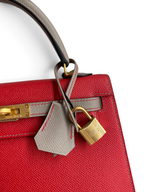 SWORD LUXURY marka, kırmızı ve gri Epsom deri detaylı, altın donanımlı ve asma kilitli Hermès Kelly 25 çanta.