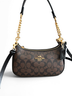 SWORD LUXURY kahverengi monogram desenli, altın zincir detaylı ve deri askılı şık Coach Teri omuz çantası.