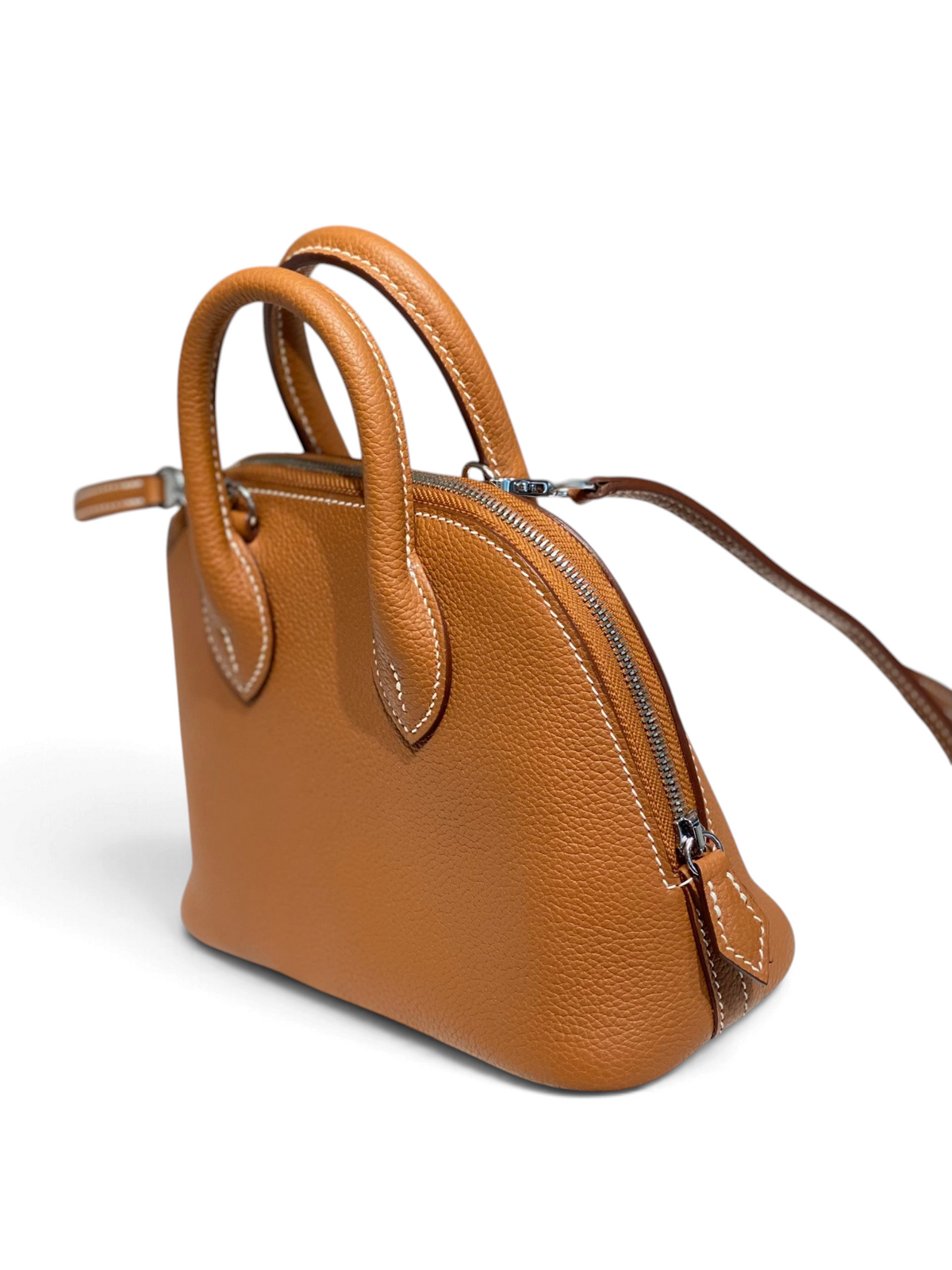 SWORD LUXURY taba rengi deri Hermès Bolide Mini 19 çanta, ikonik kubbe silüeti ve zarif dikiş detaylarıyla.