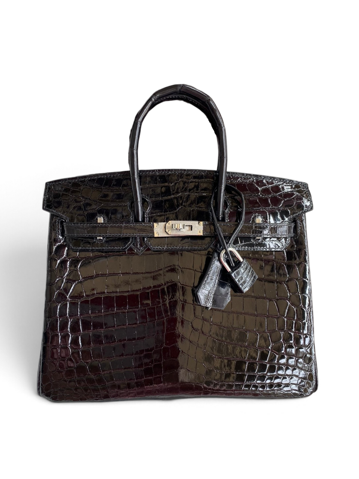 SWORD LUXURY siyah timsah derisi görünümlü, parlak yüzeyli ve gümüş donanımlı 25 cm Birkin çanta kutusunda.
