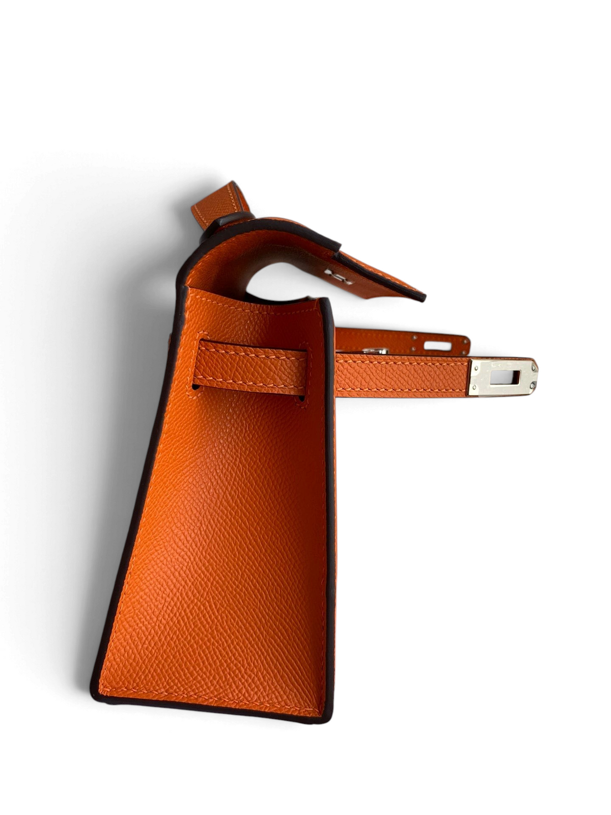 SWORD LUXURY 22cm turuncu Epsom deri Mini Kelly çanta, yan profilden görünüm ve metalik döner kilit detayı.