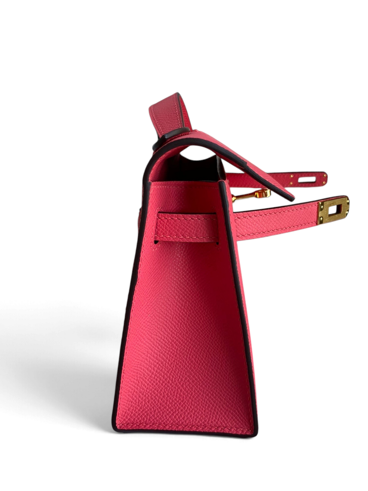 SWORD LUXURY 22cm pembe Epsom deri Mini Kelly çanta, yan profilden görünüm ve ikonik döner kilit detayı.