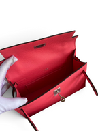 SWORD LUXURY marka, 22 cm pembe Epsom deri Mini Kelly çanta, iç kısmı ve metalik kilit detayı ile kutusunda.