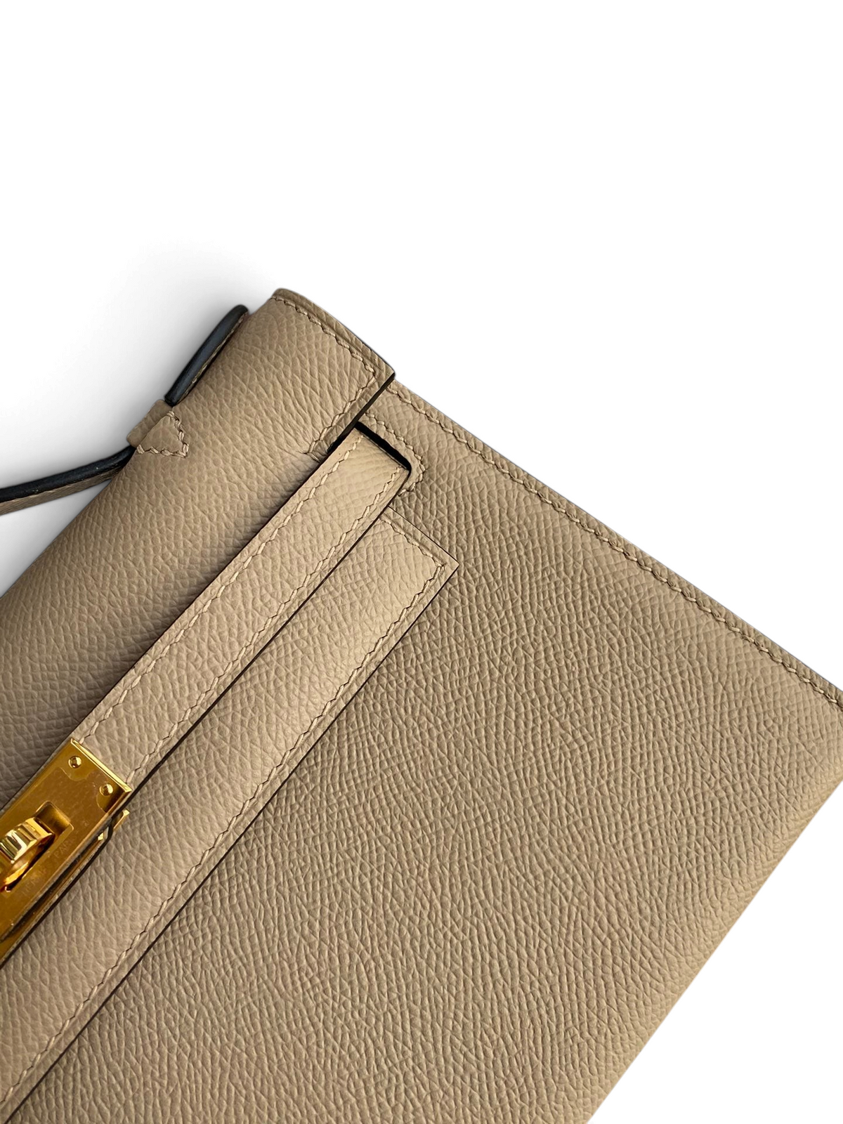 SWORD LUXURY 22 cm bej Epsom deri Mini Kelly çanta, altın rengi döner kilit detayı ve ince dikişli dokulu yüzey.