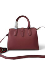 SWORD LUXURY Jackie mini tote çanta, bordo renkli dokulu vegan deri, altın detaylı ve çıkarılabilir omuz askılı.