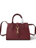 SWORD LUXURY Jackie mini tote çanta, dokulu bordo vegan deri, altın tonlu toka ve çıkarılabilir omuz askılı tasarım.
