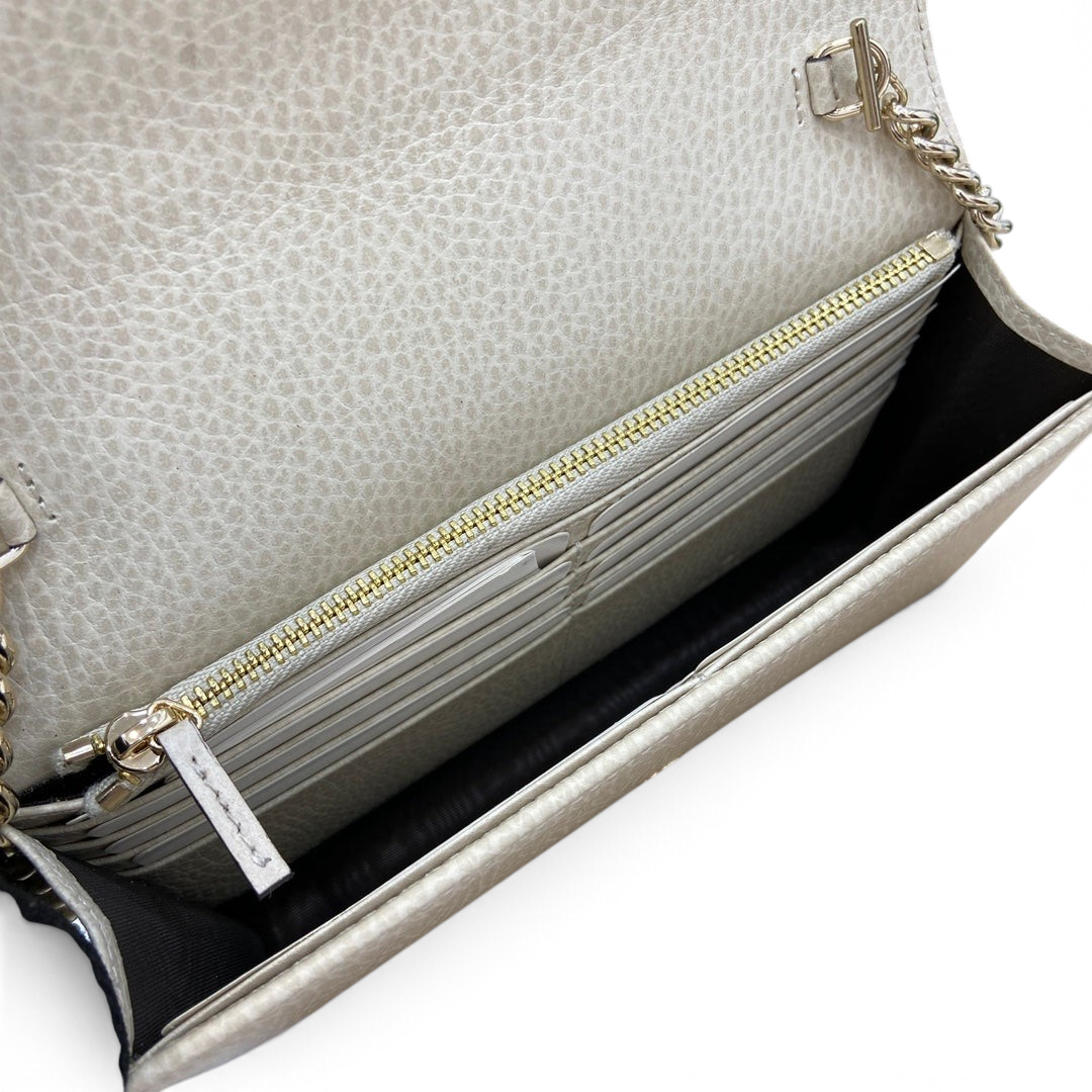 SWORD LUXURY Blondie mini çanta, bej dokulu deri iç kısım, altın fermuarlı bölme ve kartlık detayları ile.