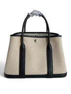 SWORD LUXURY marka, bej kanvas ve siyah deri detaylı, 30 cm boyutunda şık Hermès Garden Party tote çanta.