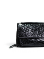 SWORD LUXURY imzalı, siyah kapitone desenli ve ikonik YSL logolu, crinkle deri Saint Laurent Niki omuz çantası.