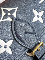 SWORD LUXURY Louis Vuitton Diane çanta, krem ve siyah Monogram Empreinte deri detaylı, altın rengi tokalı.