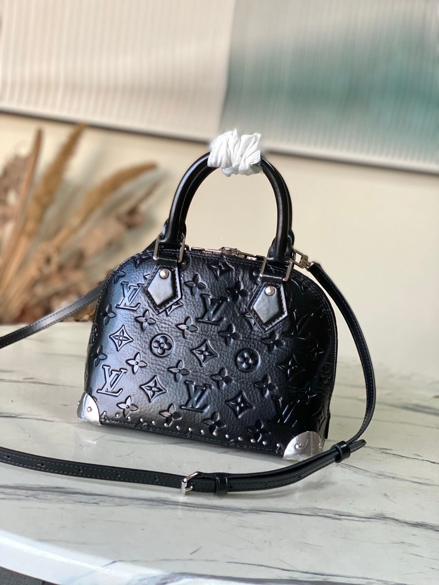 Alma BB Monogram Embossed Leather Handbag