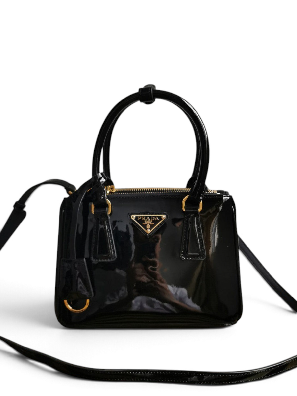 SWORD LUXURY Prada Mini Galleria siyah rugan deri çanta, altın tonlu logo detaylı ve ayarlanabilir omuz askılı.
