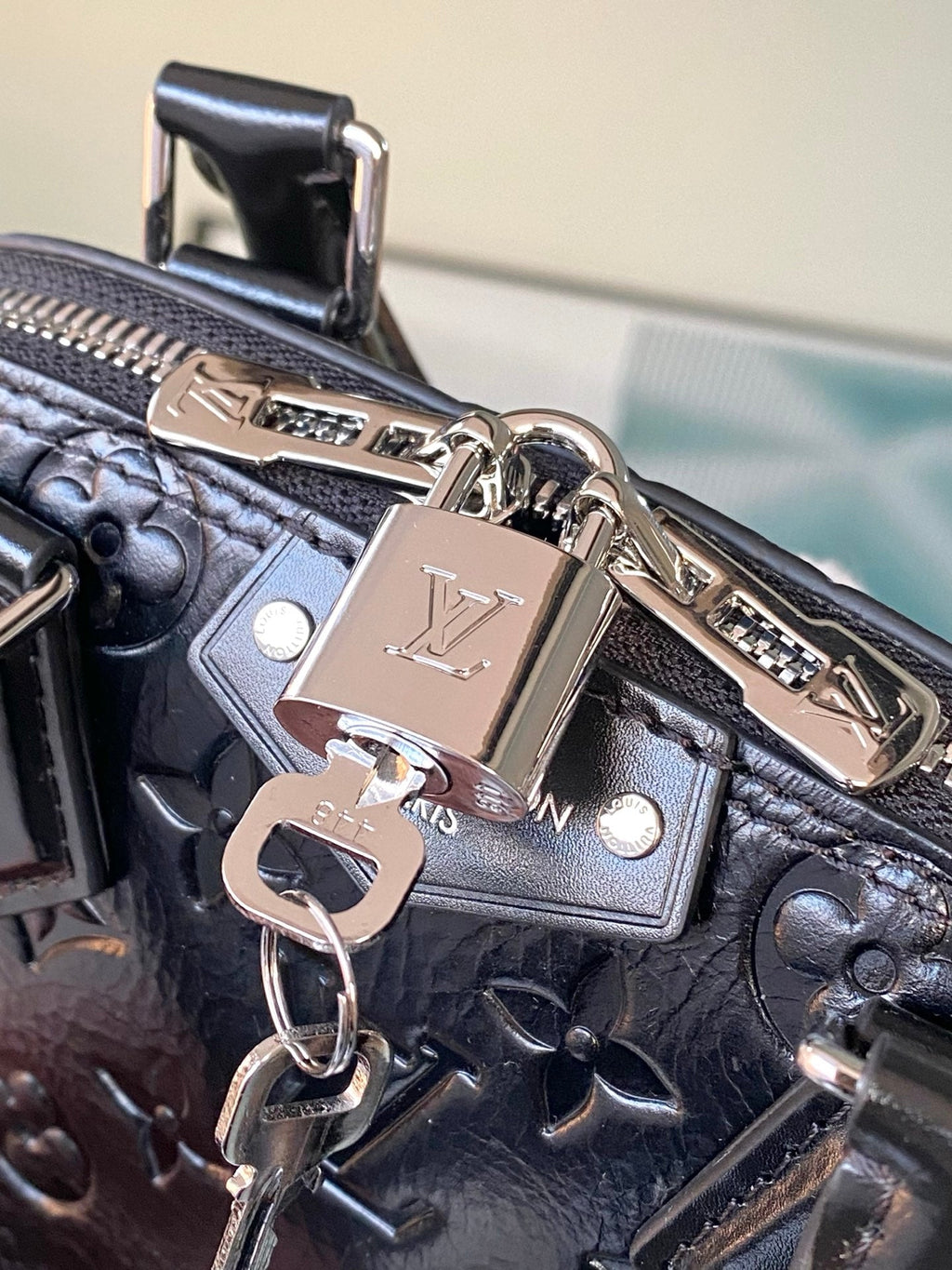 Alma BB Monogram Embossed Leather Handbag
