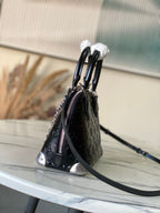 Alma BB Monogram Embossed Leather Handbag