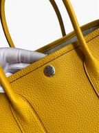 SWORD LUXURY Hermès Garden Party 30 sarı deri çanta, gümüş renkli çıtçıt detaylı ve kaliteli deri dokulu tote çanta.