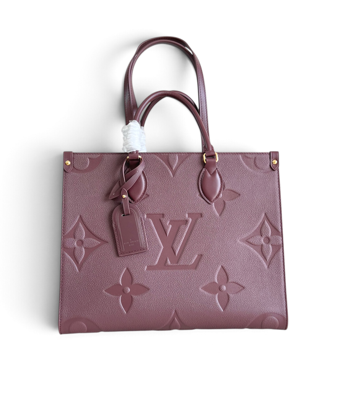 SWORD LUXURY bordo renkli, kabartma Monogram desenli, deri Louis Vuitton OnTheGo MM çanta.