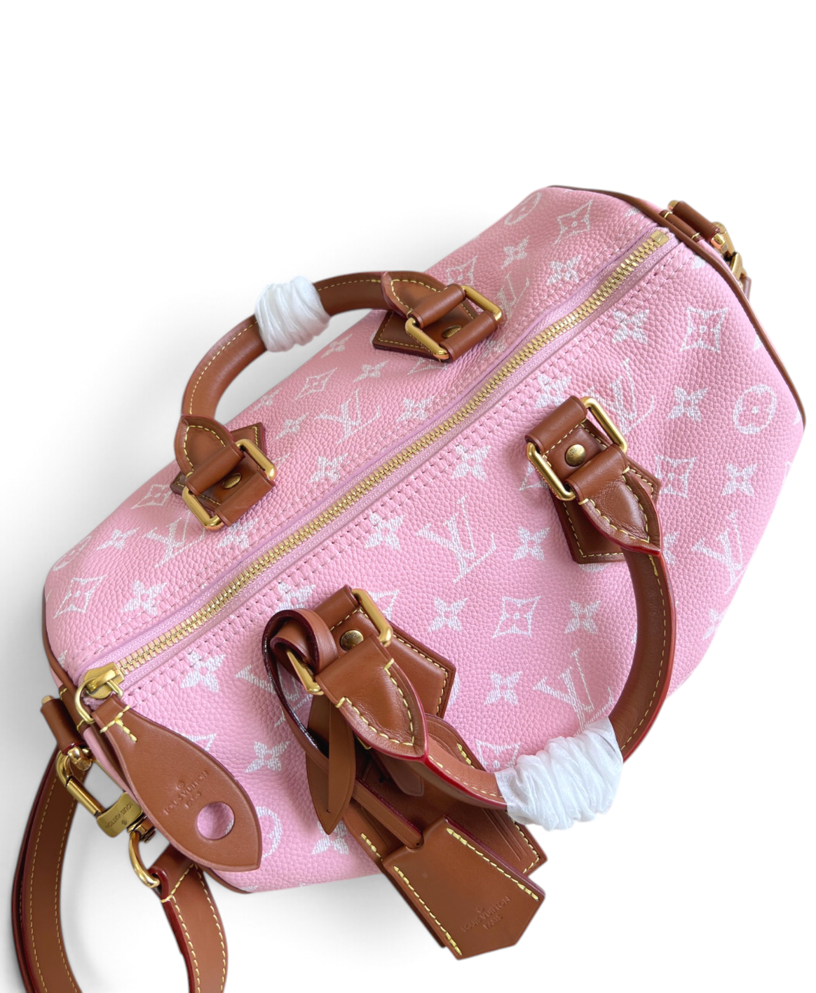 SWORD LUXURY pembe monogram kanvas Louis Vuitton Speedy Bandouliere 30 çanta, kahverengi deri detaylı ve altın donanımlı.