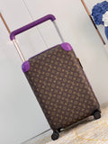 Brown suitcase with purple accents on a light wooden floor.
