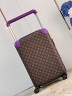 Brown suitcase with purple accents on a light wooden floor.