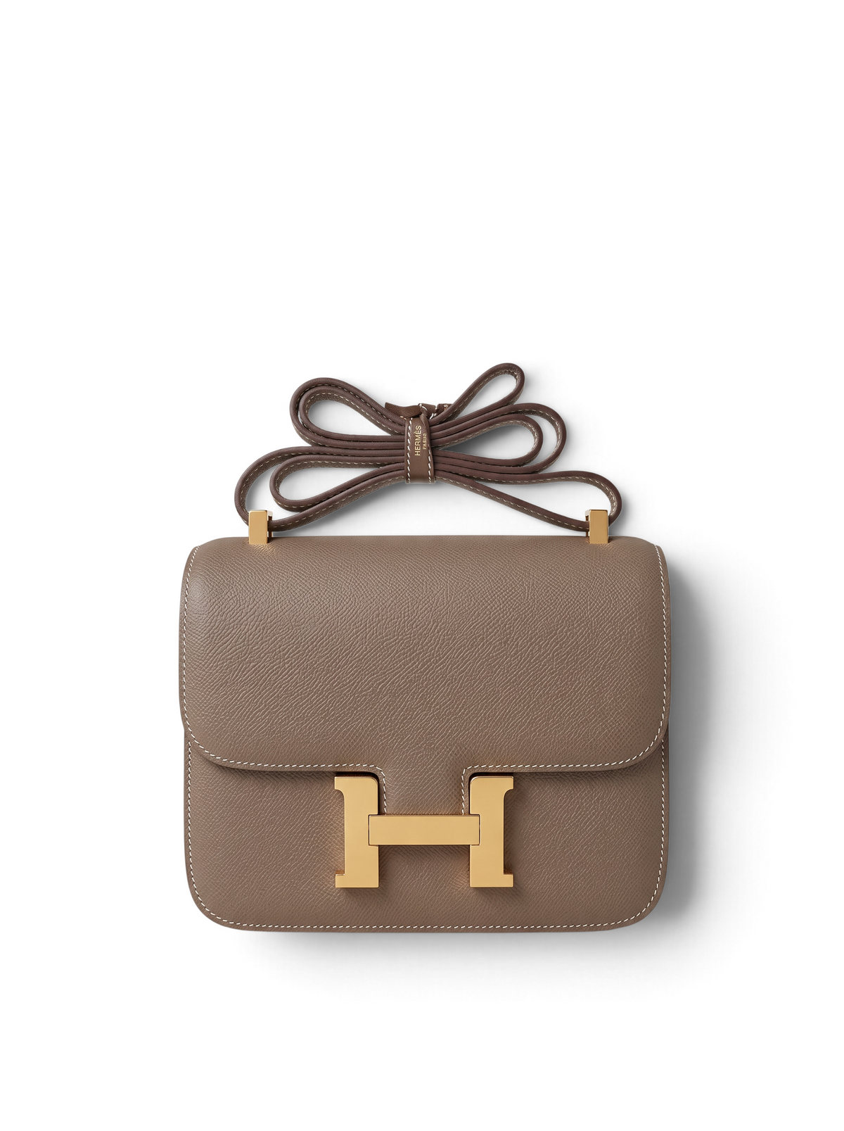 SWORD LUXURY Hermès Constance 23 çanta, taupe deri ve altın tonlu H tokalı, zarif ve lüks bir omuz çantası tasarımı.