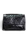 SWORD LUXURY siyah crinkled deri Saint Laurent Niki orta boy omuz çantası, ikonik YSL logolu ve kapitone detaylı.