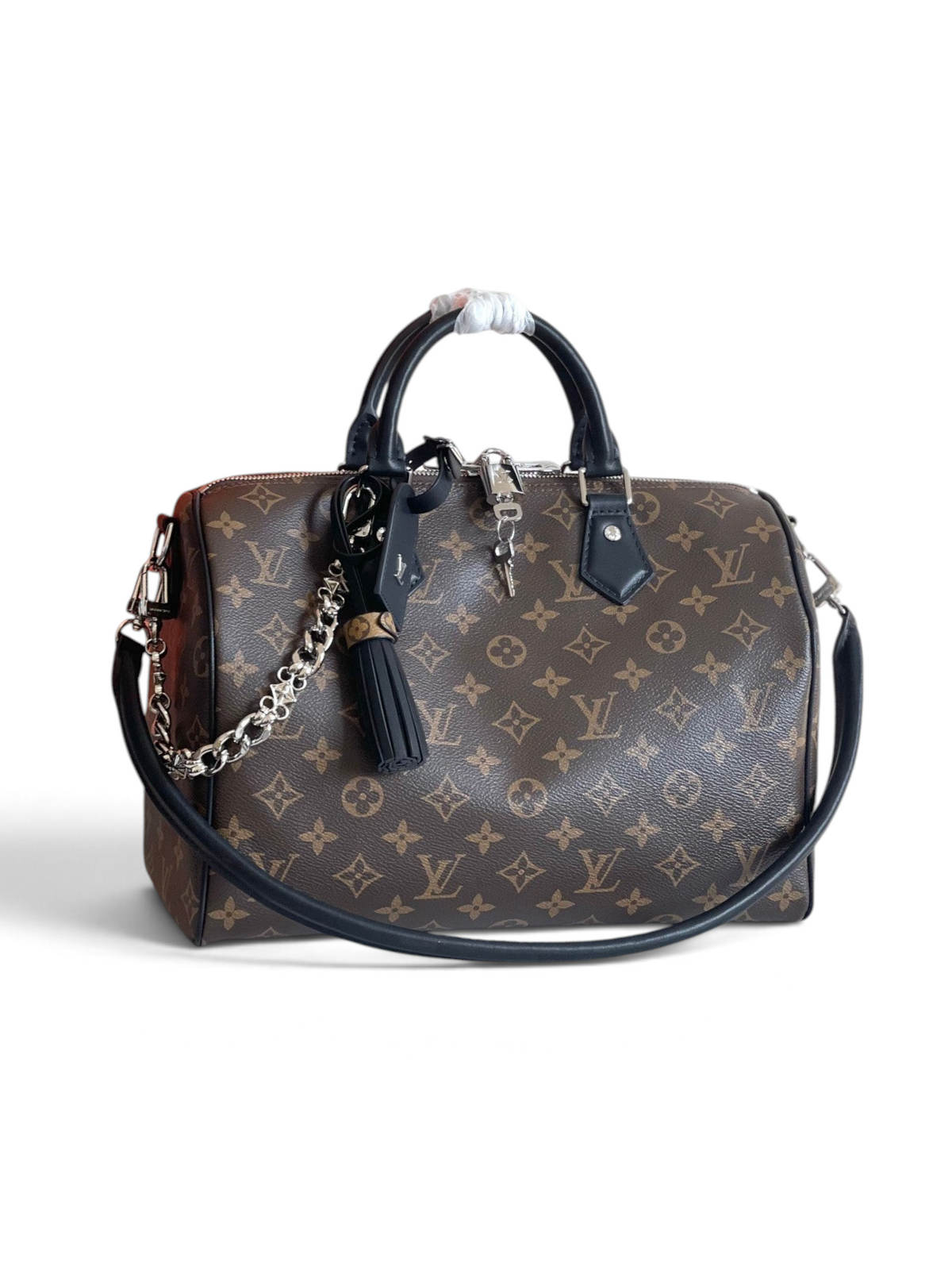 SWORD LUXURY Speedy Bandoulière 30 çanta, ikonik monogram kanvas, siyah deri detaylar ve gümüş tonlu zincir süslemeli.