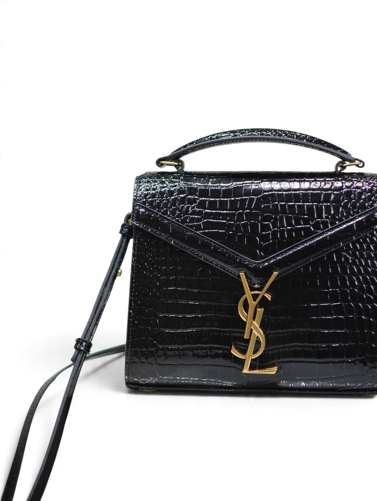 SWORD LUXURY siyah timsah derisi görünümlü Cassandra mini çanta, altın tonlu YSL monogram detaylı ve saplı tasarım.