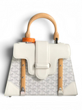 SWORD LUXURY white Goyardine canvas Saïgon PM handbag with beechwood handle and leather trim, shown with brand packaging.