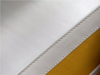 SWORD LUXURY Goyard Saigon PM handbag interior featuring white leather trim and yellow canvas lining with logo stamp