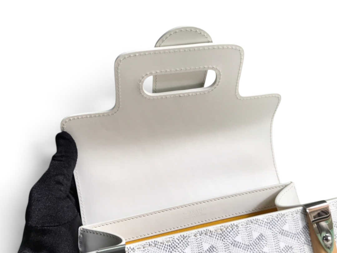 SWORD LUXURY Saïgon PM handbag featuring white Goyardine canvas, smooth leather trim, and a structured flap closure.