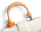 SWORD LUXURY Saïgon PM handbag featuring a white leather body and a distinctive curved beechwood top handle.