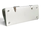SWORD LUXURY Saïgon PM handbag base showing white leather, silver protective feet, and detachable shoulder strap.