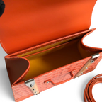 SWORD LUXURY Saïgon PM handbag in orange Goyardine canvas with smooth leather trim and a beechwood top handle.