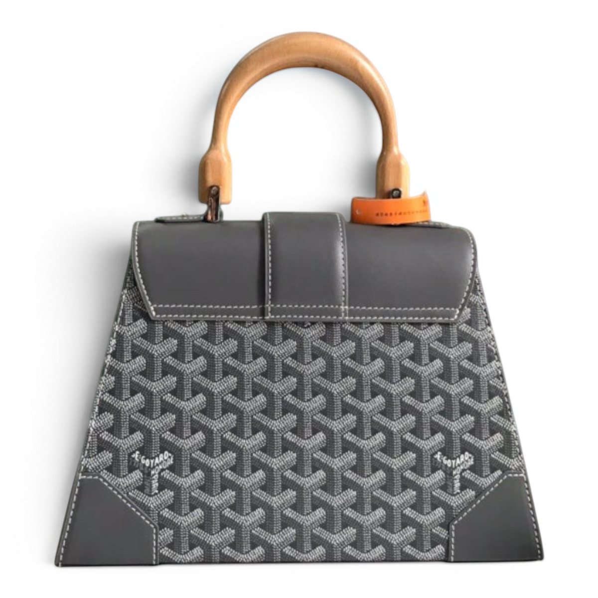 SWORD LUXURY grey Goyardine canvas Saïgon PM handbag with beechwood handle and leather trim in front of gift boxes