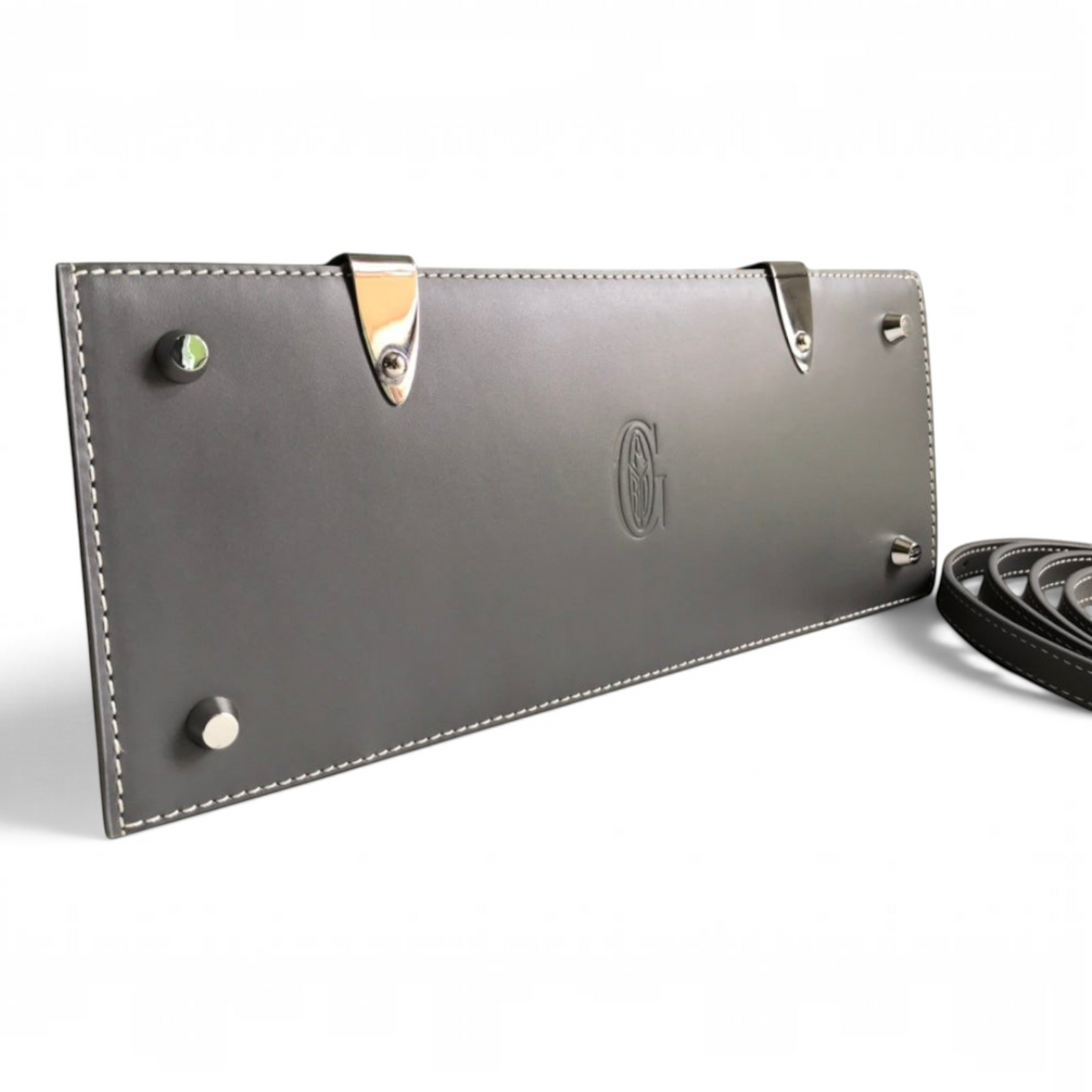 SWORD LUXURY Saïgon PM handbag base showing grey leather, silver protective feet, and embossed logo detail.
