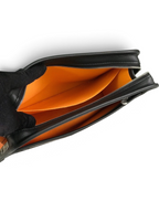 SWORD LUXURY Jouvence Toiletry Bag interior view showing vibrant orange lining and black leather trim