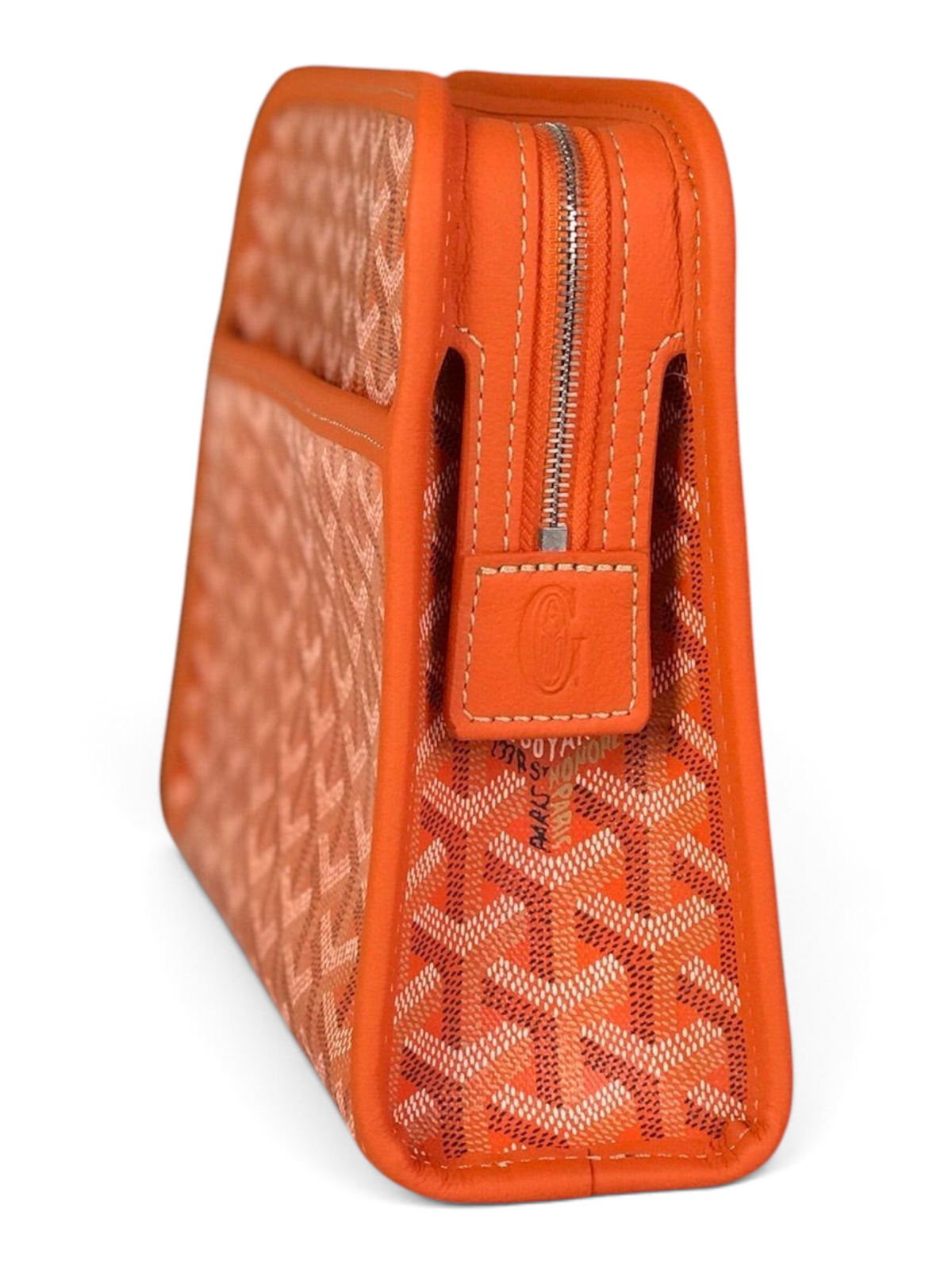 SWORD LUXURY orange Goyardine canvas Jouvence toiletry bag with leather trim and zip closure in front of brand boxes