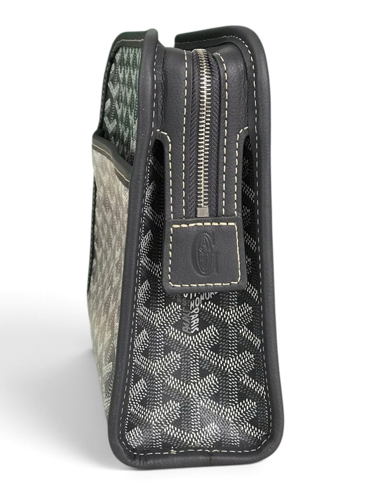 SWORD LUXURY Jouvence toiletry bag in grey Goyardine canvas with leather trim and zip closure on a marble surface.