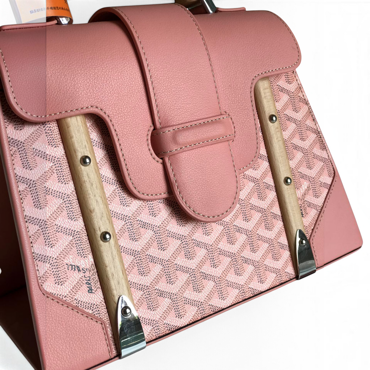 SWORD LUXURY pink Goyardine canvas Saïgon PM handbag with smooth leather trim and signature beechwood top handle.
