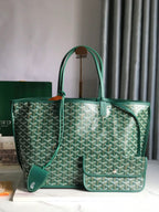 Green patterned handbag on a white surface with a blurred background