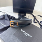 Black Saint Laurent belt with gold buckle on a branded box