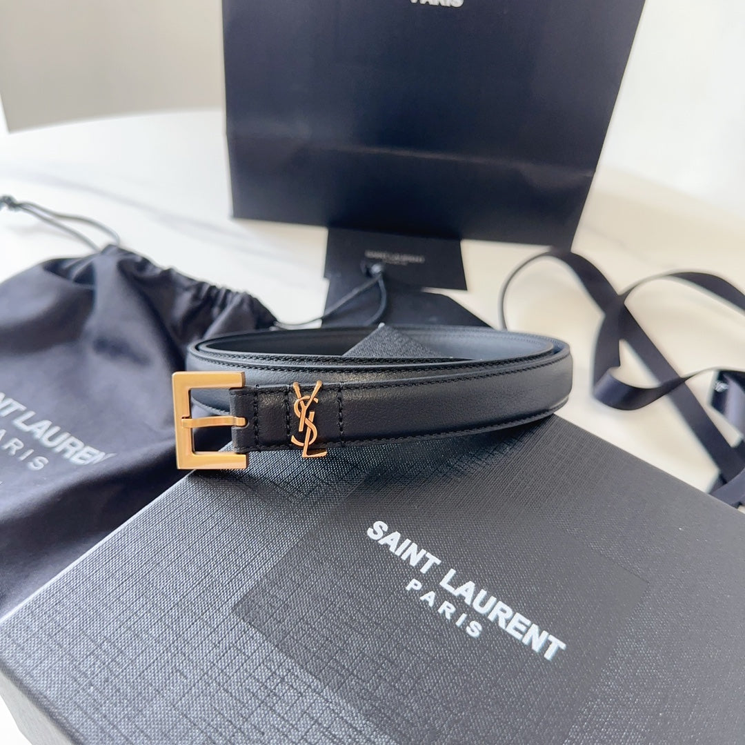 Black Saint Laurent belt with gold buckle on a branded box