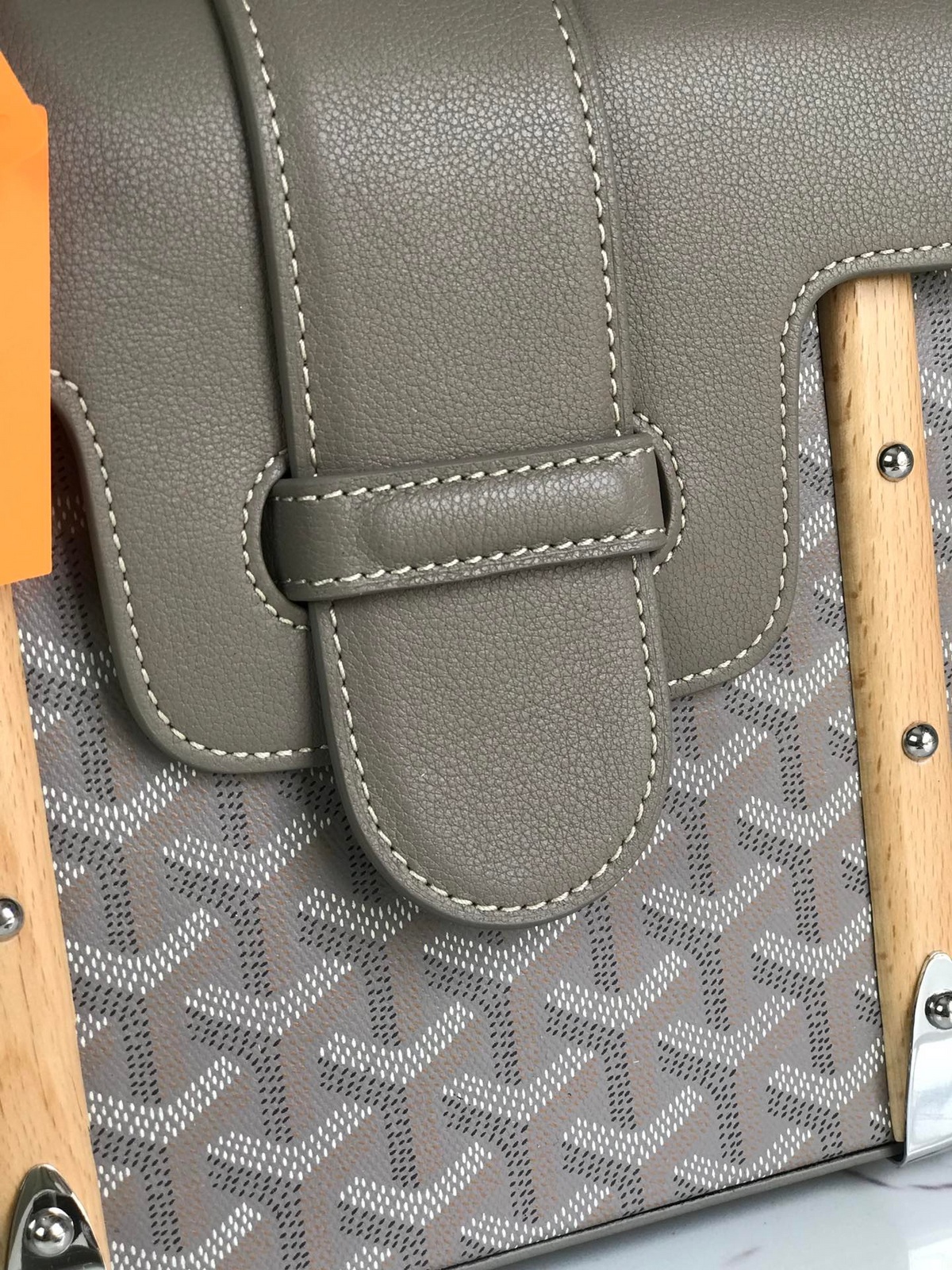 SWORD LUXURY Saïgon PM handbag in grey Goyardine canvas with smooth leather trim and a beechwood handle.