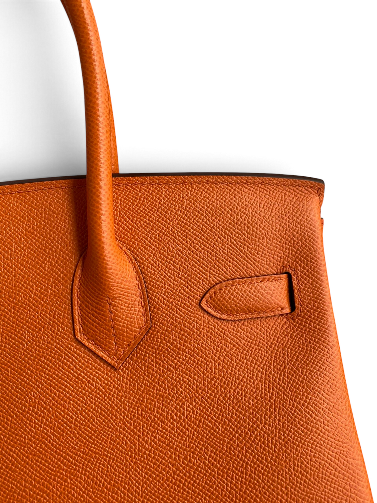 SWORD LUXURY turuncu Epsom deri Hermès Birkin 30 çanta detayı, belirgin dokulu yüzey ve zarif dikişler.